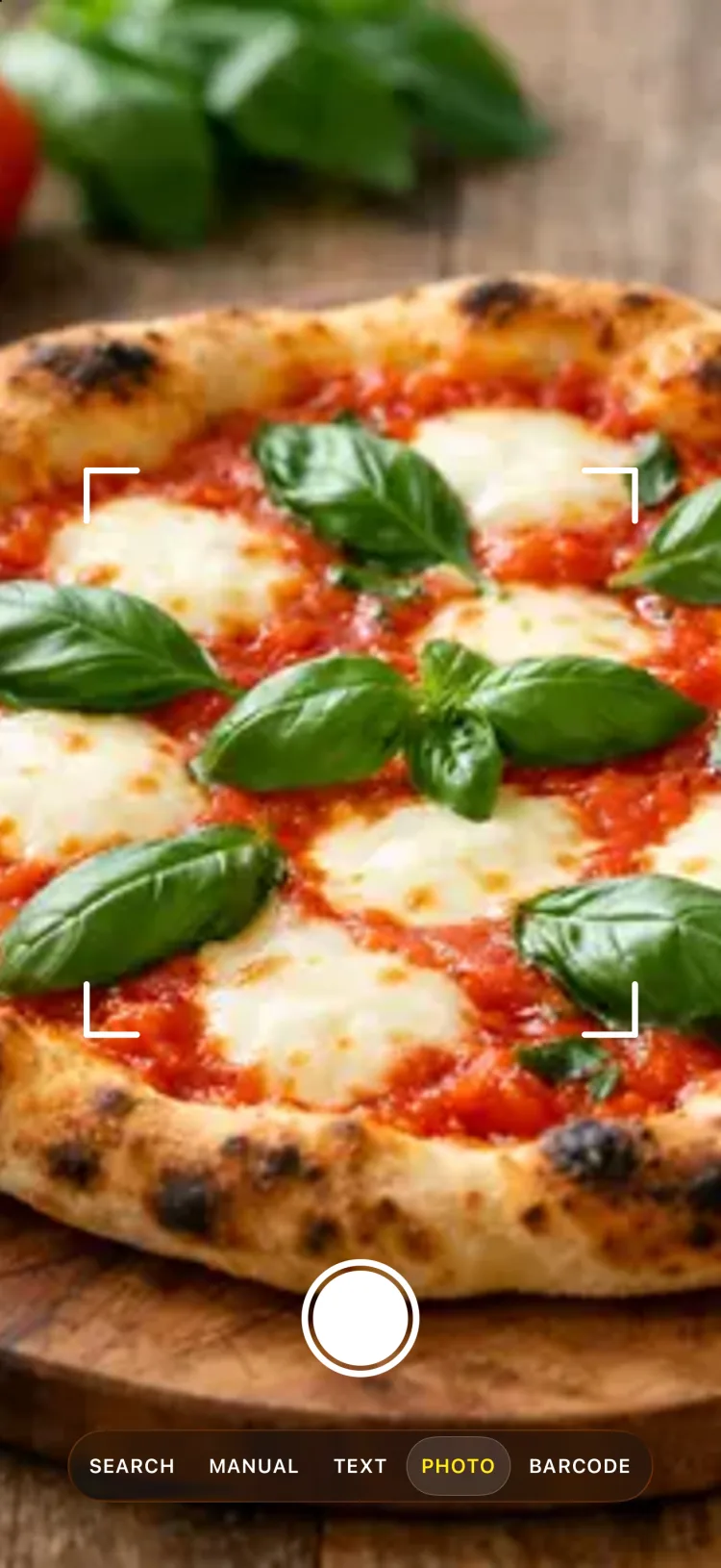 Die Kamera der App über einer Margherita‑Pizza mit dem Sucher